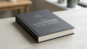 Closed hardcover book titled The Augmented Work Guide by Teal Agility on a light-colored surface